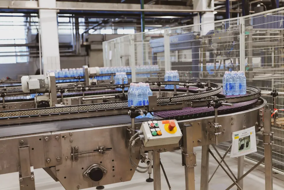 Injection moulded plastic parts on a production line